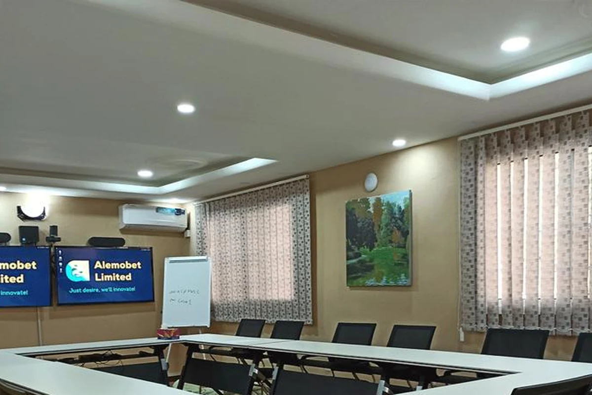 A# Media conference room with dual displays, meeting tables and videoconference equipment